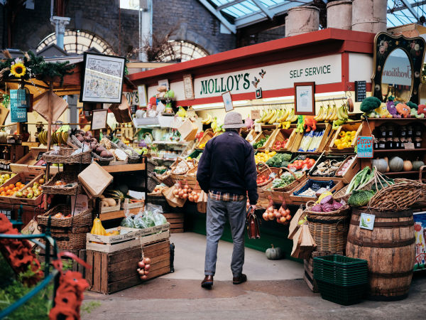 Man shopping for fruit and vegetables in a traditional market