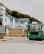 Jersey BUs and Boat Tours open top bus on the coast road